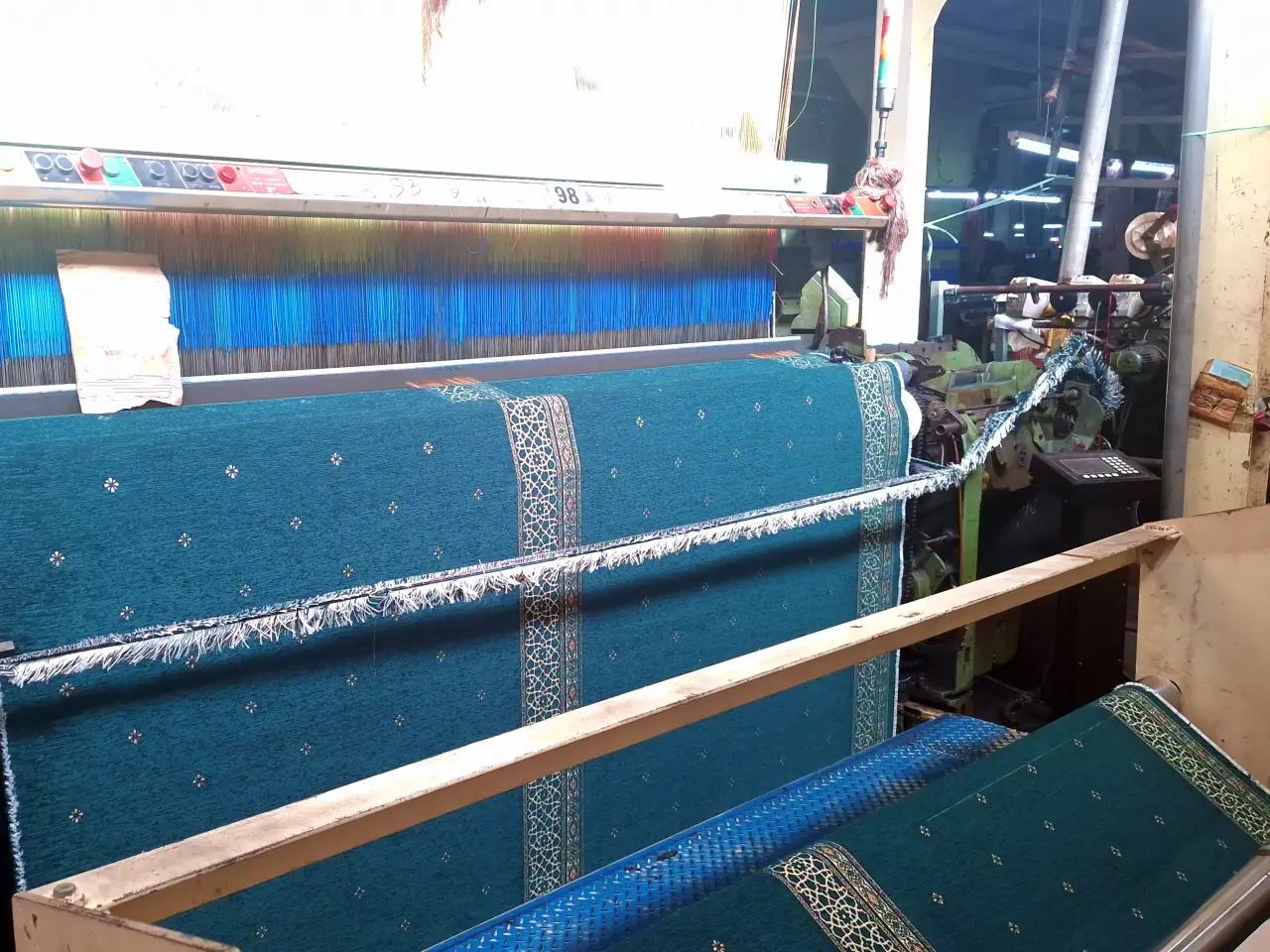 Industrial weaving machine producing premium Chenille carpets with intricate patterns for global export at Sakakriya factory